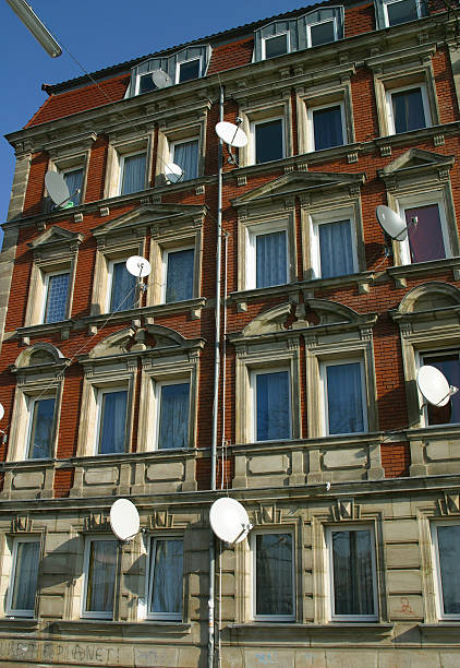 residential satellite dishes every appartment has an own TV satellite dish parabol stock pictures, royalty-free photos & images