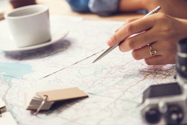 istock Travel planning - map with note  pen and camera 910782058