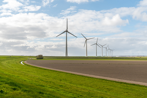 Large view on the windmills on the field