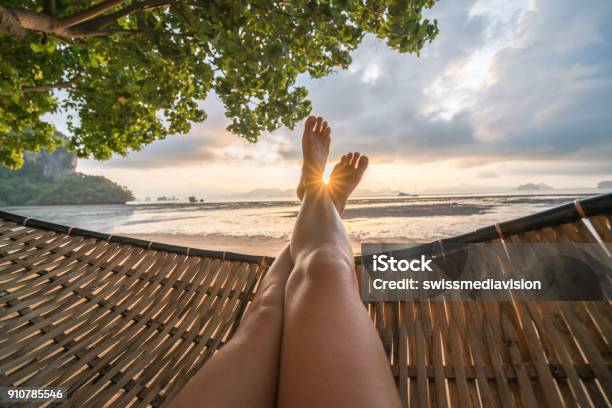 Personal Perspective Of Woman Relaxing On Hammock Feet View Stock Photo - Download Image Now