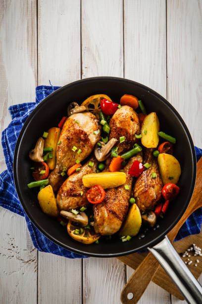 istock Barbecued chicken drumstick with vegetables 910785616