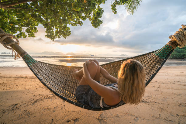 istock Relaxing time, girl on hammock 910786030