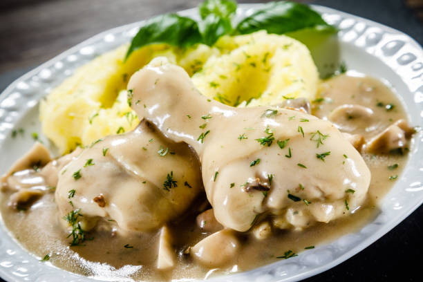 istock Roast chicken leg with boiled potatoes and vegetable salad 910786342