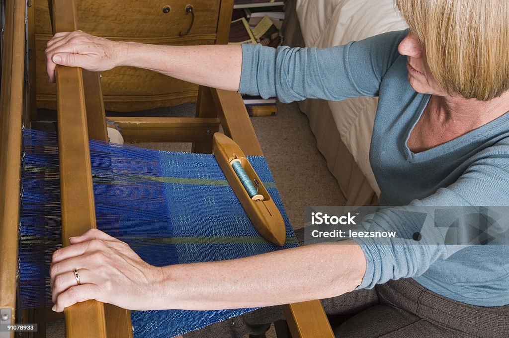 Woman Weaving on a Loom  Activity Stock Photo