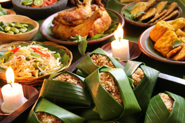 istock Nasi Tutug Oncom with Side Dishes on Wooden Table 910794136