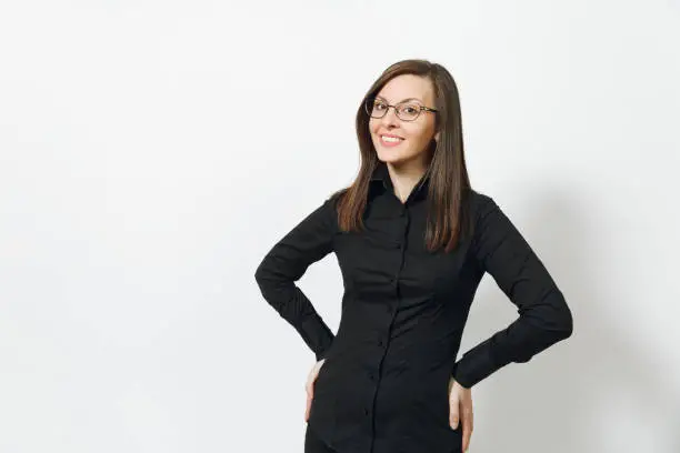 Beautiful happy caucasian young smiling brown-hair business woman in black classic shirt, skirt, glasses isolated on white background close up. Manager, worker, student. Copy space for advertisement