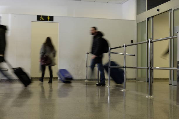 istock blurred people at the airport 910794202