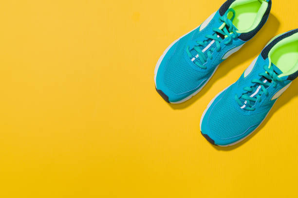 istock Fitness accessories on yellow background mock up, top view 910795188