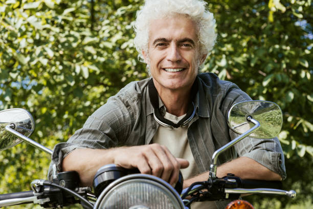 istock Confident man riding a motorbike 910799034