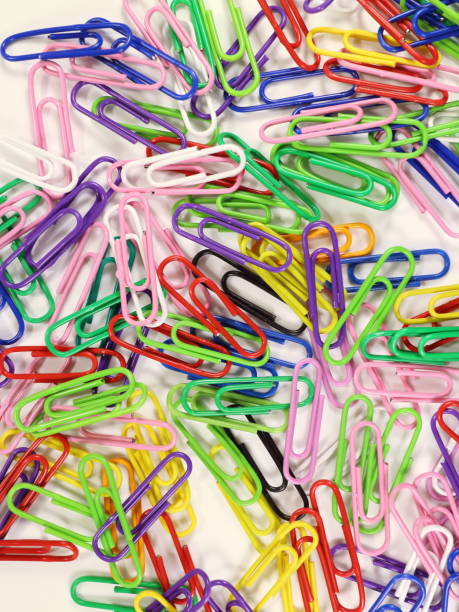istock paper clips of different colors on a white background 910802254