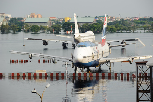 Bangkok, Thailand - November 9, 2011 : Airplanes drown in the water at Don Muang International Airport during the massive flood crisis on November 9, 2011 in Bangkok.