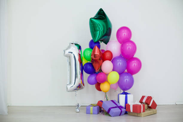 istock multi-colored balloons and gifts for the holiday 910805926