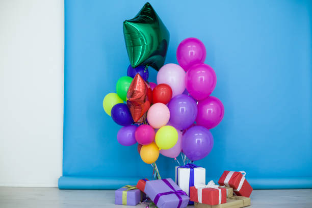istock multi-colored balloons and gifts for the holiday 910806584