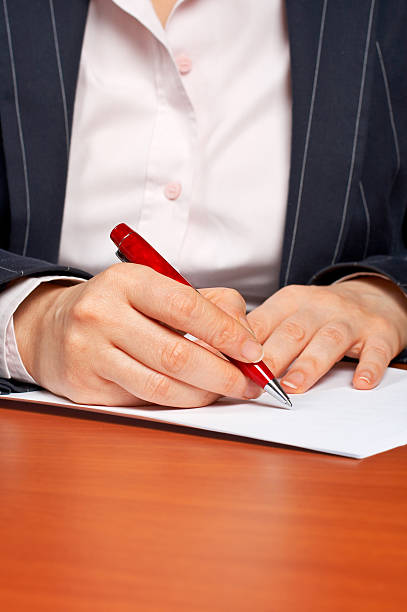 istock Business woman writing a contract 91081057