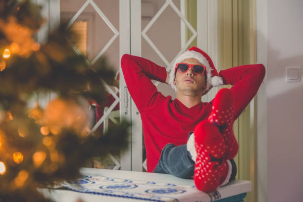 istock Young modern guy enjoying Christmas spirit 910814514