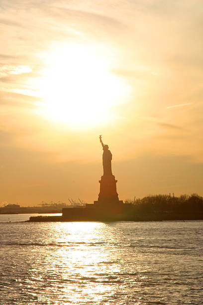 istock Statue of Liberty - hazey sunset. 91082152