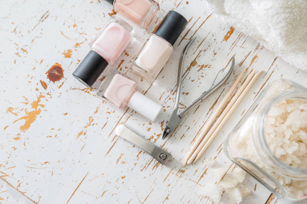 istock Selection of manicure tools on white wood background 910823174