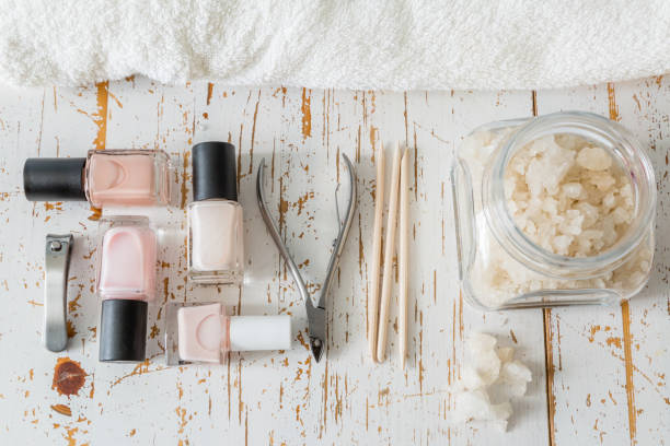 istock Selection of manicure tools on white wood background 910823844