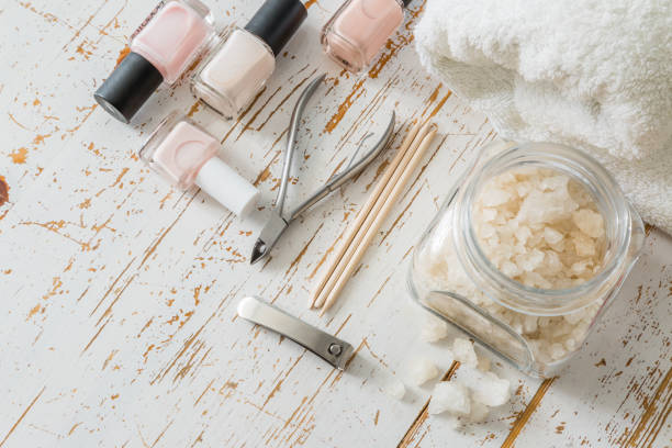 istock Selection of manicure tools on white wood background 910823862