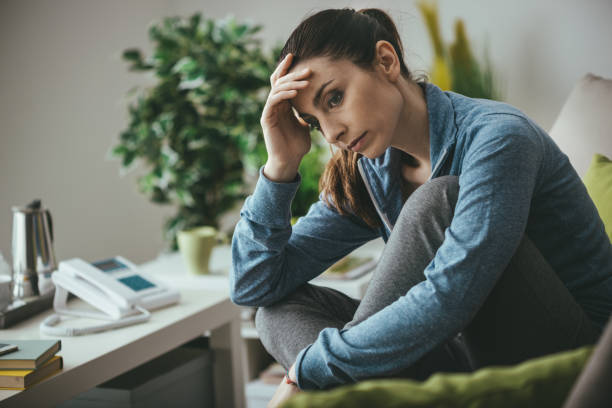 istock Depressed woman at home 910824814