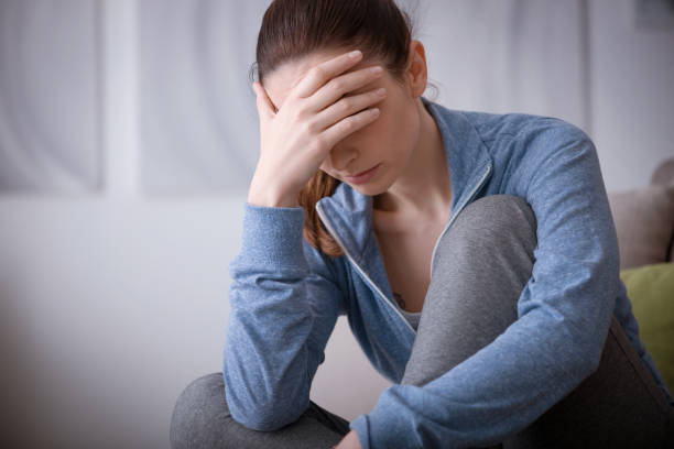 istock Depressed woman at home 910825074