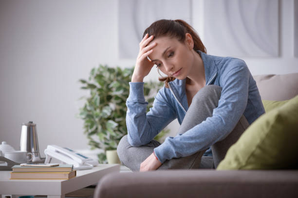 istock Depressed woman at home 910827178