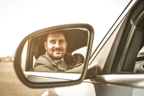 istock Business man in car. 910828484