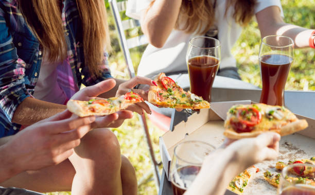 istock Cheerful friends on picnic 910829750