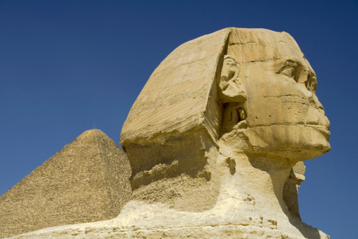 Great Sphinx of Giza with pyramid in the background.