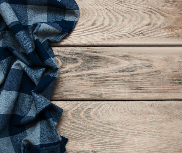 istock Checkered napkin on a wooden background 910836230