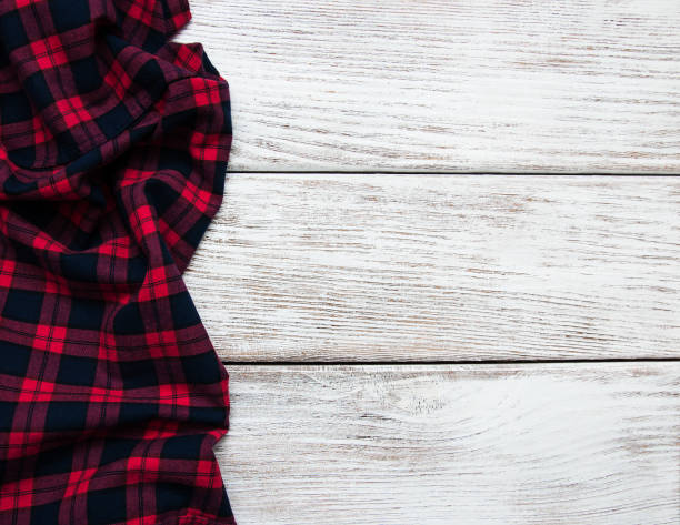istock Checkered napkin on a wooden background 910836392