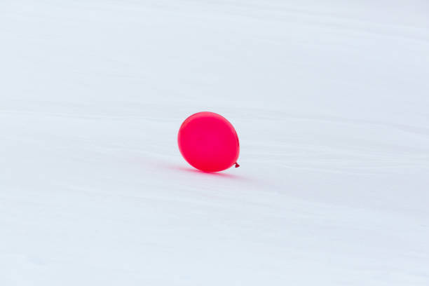 Red balloon on white background, space for text
