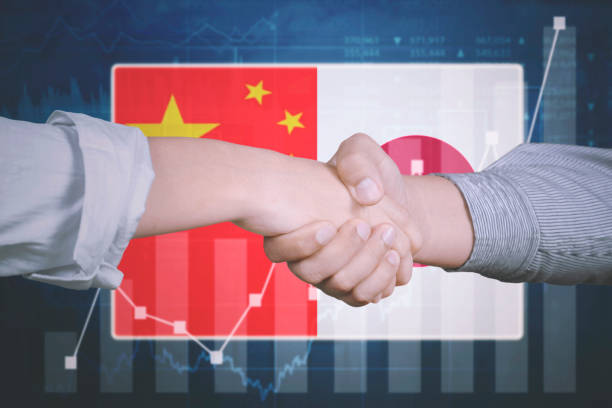 istock Business agreement with Japan and China flag 910840266