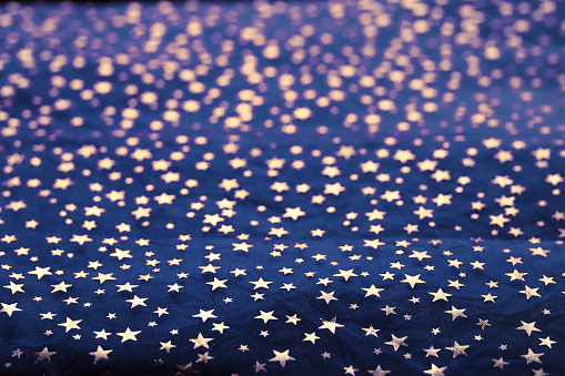 Stars of different colors on a black background
