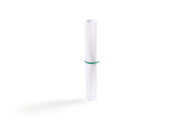 istock Scroll of white paper on a white background. Closeup 910851502