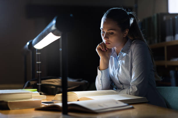 istock Woman studying late at night 910852470