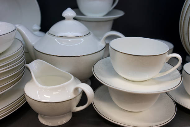istock White tea-table porcelain set on a dark shelf in the store 910852972