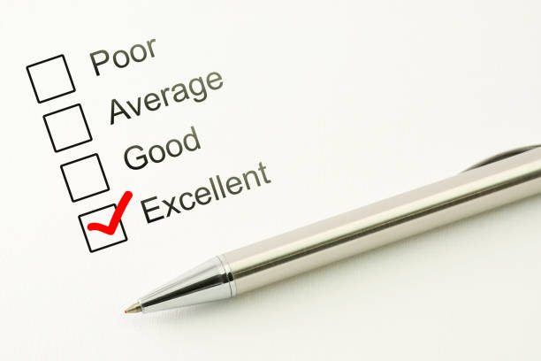 istock Excellent customer service feed back. Consumer satisfaction concept. Marked checkbox with a pen on paper background 910856056