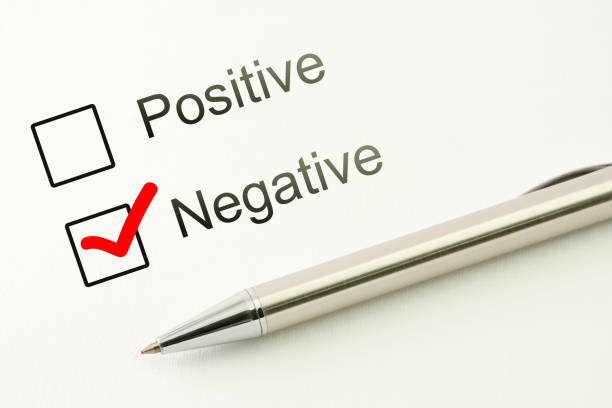 istock questionnaire: negative choice or positive, marked checkbox with a pen on paper background. Disapproval concept 910856086