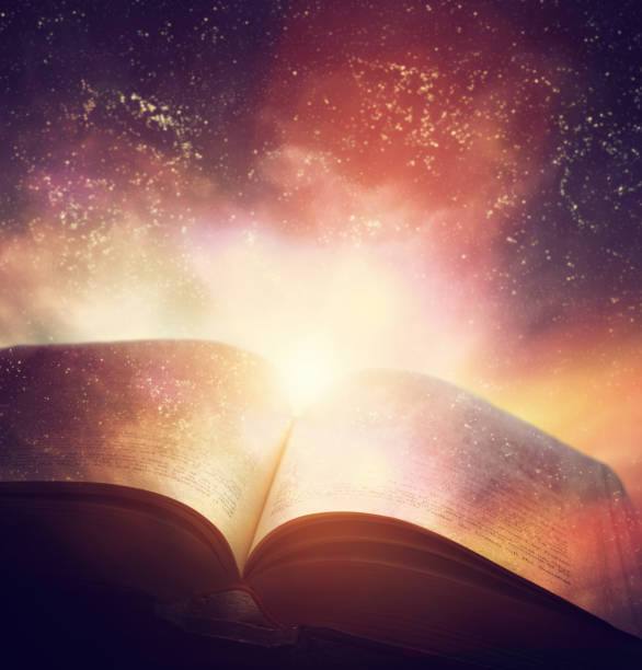 Open old book merged with magic galaxy sky, stars. Literature, horoscope Open old book merged with magic galaxy sky, universe, stars. Concept of literature, fantasy, horoscope, religion etc. holy book stock pictures, royalty-free photos & images