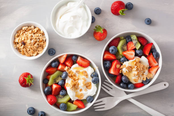 istock fruit berry salad with yogurt and granola for healthy breakfast 910859828