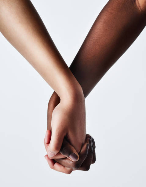 The power to love is in your hands Cropped studio shot of two women holding hands couple holding hands stock pictures, royalty-free photos & images