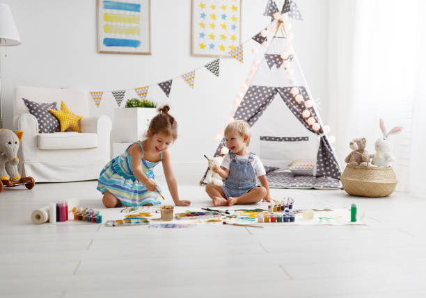happy funny children paint with paint