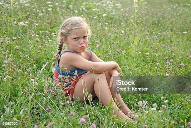 Sad Girl In A Blooming Meadow Stock Photo - Download Image Now - Anger, Beauty, Beauty In Nature