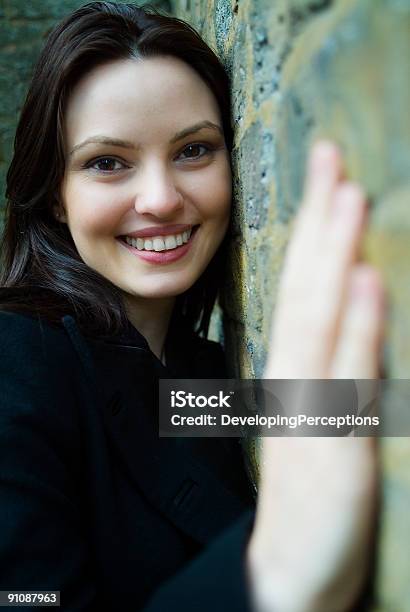 Hugging The Wall Stock Photo - Download Image Now - Adult, Beautiful People, Beautiful Woman