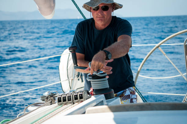 istock skipper sailing with his boat 910884444