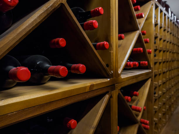 istock close up view of arranged wine bottles in cellar 910892868