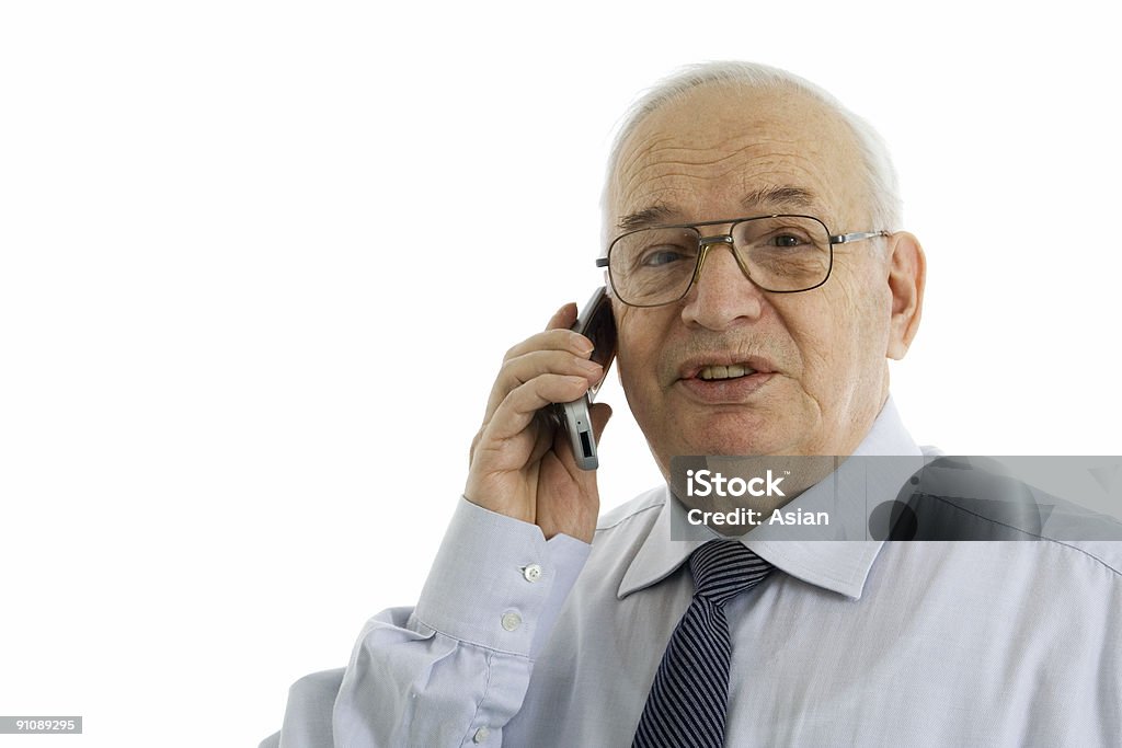 成熟したビジネスマンが携帯電話で話している - 1人のロイヤリティフリーストックフォト