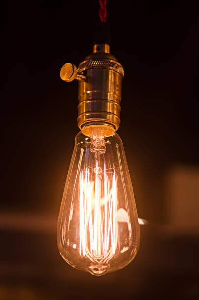 istock Close-Up Of Illuminated Light Bulb 910893284