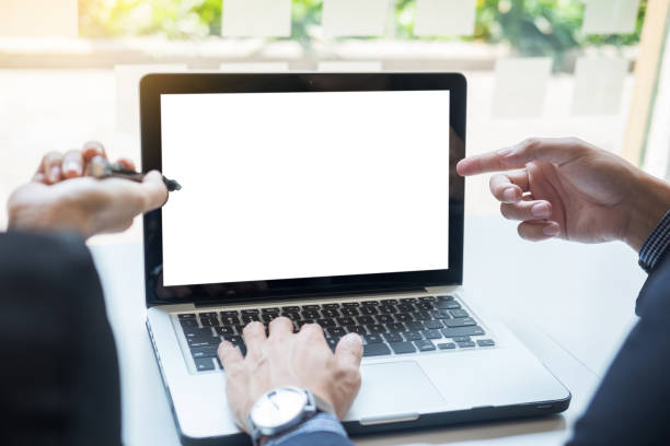 istock Cropped Image Of Business People Discussing Over Laptop Computer 910893442